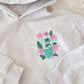 SURFING THE WAVES EMBROIDERED HOODIE