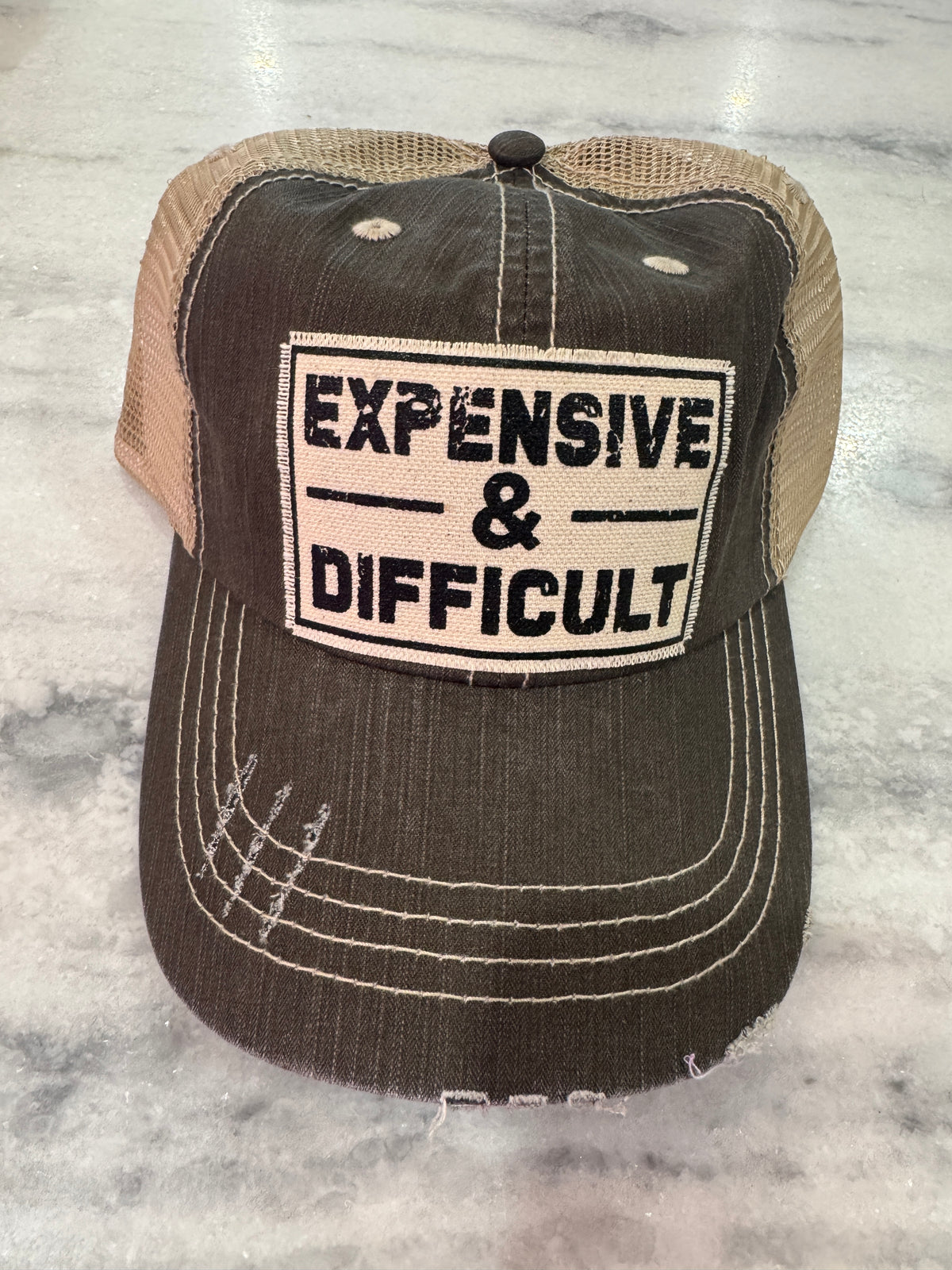 EXPENSIVE AND DIFFICULT HAT