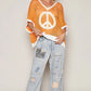 KNIT SHORT SLEEVE PEACE SIGN SWEATER