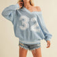 VARSITY V-NECK SWEATER TOP